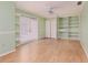 Bedroom with light green walls, bright natural light, a ceiling fan, and built-in shelves at 3906 Canyon Lake Pt, Lakeland, FL 33813