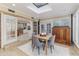 Bright dining room features a skylight, tile floor, brick accents and table for four at 3906 Canyon Lake Pt, Lakeland, FL 33813