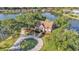 Beautiful home with lovely stone accents and a circular driveway, surrounded by trees at 3906 Canyon Lake Pt, Lakeland, FL 33813