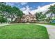 Charming two-story home with manicured lawn and mature trees at 3906 Canyon Lake Pt, Lakeland, FL 33813