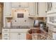 Close up of the kitchen sink, granite countertops, bronze fixtures, and tile backsplash at 3906 Canyon Lake Pt, Lakeland, FL 33813