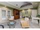 Living room features natural lighting, decorative chairs, and an area rug at 3906 Canyon Lake Pt, Lakeland, FL 33813