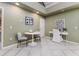 Living room features natural lighting, a decorative table and chairs, and a workspace at 3906 Canyon Lake Pt, Lakeland, FL 33813