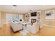 Spacious living room with hardwood floors, a cozy fireplace, and ample natural light at 3906 Canyon Lake Pt, Lakeland, FL 33813