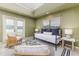 Sun room includes a trundle bed, French doors to the backyard, and tile floor at 3906 Canyon Lake Pt, Lakeland, FL 33813