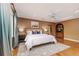 Bedroom with blue drapes and hardwood floors, complete with a ceiling fan at 3906 Canyon Lake Pt, Lakeland, FL 33813