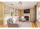 Sitting area with hardwood floors, a fireplace and sitting area, and a built in bookshelves at 3906 Canyon Lake Pt, Lakeland, FL 33813