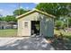 Exterior workshop with an open doorway and concrete pad at 4014 Mossy Oak Dr, Lakeland, FL 33810