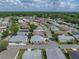 Aerial view of a single Gathering home in a lovely neighborhood with mature trees and well kept streets at 4965 Goldenview Ln, Lakeland, FL 33811