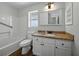 Bathroom featuring granite vanity top, window, and shower-tub combination at 4965 Goldenview Ln, Lakeland, FL 33811