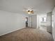 Bright bedroom featuring neutral carpet, ceiling fan, and access to an ensuite bathroom at 4965 Goldenview Ln, Lakeland, FL 33811