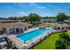 An inviting community pool area with gazebo, tables, chairs, and a pristine swimming pool at 4965 Goldenview Ln, Lakeland, FL 33811