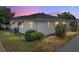 Rear view of home showing the lawn, siding and bushes that line the perimeter at 4965 Goldenview Ln, Lakeland, FL 33811