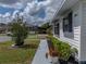 Close up of the home's exterior showing the manicured bushes, window awning and street at 4965 Goldenview Ln, Lakeland, FL 33811