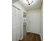 Entryway and hallway featuring wood-look floors, and a linen closet at 4965 Goldenview Ln, Lakeland, FL 33811