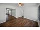 Open-concept living room with wood-look flooring and ceiling fan at 4965 Goldenview Ln, Lakeland, FL 33811