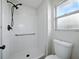 Clean shower with new fixtures, grab bar, and a window for natural light at 4965 Goldenview Ln, Lakeland, FL 33811