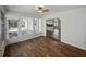 Sunroom open to the kitchen features beautiful wood-look floors and lots of natural light at 4965 Goldenview Ln, Lakeland, FL 33811