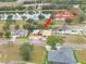 New construction home aerial view in a community with tree-lined streets; home address at 505 Shanklin Ave at 505 Shanklin Ave, Bartow, FL 33830