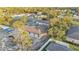 Aerial view of single Gathering home in an established neighborhood with mature trees and tidy landscaping at 505 Shanklin Ave, Bartow, FL 33830