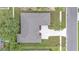 Aerial view showcasing the roof, lawn and driveways with mature trees on the property at 505 Shanklin Ave, Bartow, FL 33830