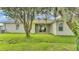 The back of the house has a nice yard and great windows that offer natural light at 505 Shanklin Ave, Bartow, FL 33830