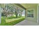 View of the covered back patio that overlooks the lush green backyard at 505 Shanklin Ave, Bartow, FL 33830