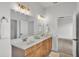 Contemporary bathroom featuring a double vanity, quartz countertop, and stylish fixtures at 505 Shanklin Ave, Bartow, FL 33830