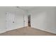 Neutral bedroom featuring a carpeted floor, white walls, and an open doorway at 505 Shanklin Ave, Bartow, FL 33830