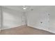 Neutral bedroom featuring a carpeted floor, white walls, and a ceiling fan at 505 Shanklin Ave, Bartow, FL 33830
