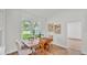 Bright dining area with a wooden table, and a view to the backyard at 505 Shanklin Ave, Bartow, FL 33830
