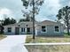 New construction home featuring stone accents, neutral colors and an attached two car garage at 505 Shanklin Ave, Bartow, FL 33830