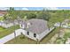 A well manicured front lawn and landscaping frame this charming single-story home with stone accent and architectural details at 505 Shanklin Ave, Bartow, FL 33830
