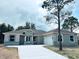 New construction home featuring stone accents, neutral colors, and an attached two car garage at 505 Shanklin Ave, Bartow, FL 33830