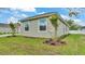 Exterior view of home showcasing the front yard, stone accents, and new landscaping at 505 Shanklin Ave, Bartow, FL 33830