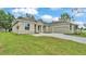 Charming single-story home featuring stone accents, a two-car garage, and a well-manicured lawn at 505 Shanklin Ave, Bartow, FL 33830