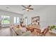 Bright living room featuring wood floors, neutral paint, stylish furniture, and French doors to the exterior at 505 Shanklin Ave, Bartow, FL 33830
