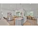 Bright open-concept living space features a modern kitchen with an island and adjacent dining area at 505 Shanklin Ave, Bartow, FL 33830