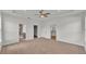 Spacious main bedroom with tray ceiling and en-suite bathroom entrances at 505 Shanklin Ave, Bartow, FL 33830