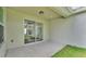 Concrete patio featuring sliding glass doors leading to a lawn at 505 Shanklin Ave, Bartow, FL 33830