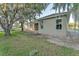 Rear exterior view of a single-Gathering home featuring lush green grass and large windows at 505 Shanklin Ave, Bartow, FL 33830