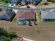 Aerial view of a single-Gathering home featuring a screened pool and spacious backyard at 5612 Vintage View Blvd, Lakeland, FL 33812