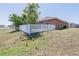 A spacious backyard is enclosed by a white picket fence, enhancing the home's charm and privacy at 5612 Vintage View Blvd, Lakeland, FL 33812
