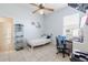 This bright bedroom features a ceiling fan, tile floors, and a neutral color scheme at 5612 Vintage View Blvd, Lakeland, FL 33812