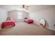 Large bonus room with two beds, a ceiling fan, and carpeted floors at 5612 Vintage View Blvd, Lakeland, FL 33812