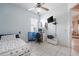 This bright bedroom has a ceiling fan, tile floors, a built-in desk, and a neutral color scheme at 5612 Vintage View Blvd, Lakeland, FL 33812
