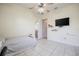 Bedroom with a bed, television, and an en-suite bathroom at 5612 Vintage View Blvd, Lakeland, FL 33812