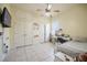 Bedroom with a bed, desk, and built-in storage cabinets at 5612 Vintage View Blvd, Lakeland, FL 33812