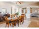 Formal dining room with a large wooden table, open to the kitchen and living areas at 5612 Vintage View Blvd, Lakeland, FL 33812