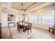Dining room with a long wooden table and view of the bright windows at 5612 Vintage View Blvd, Lakeland, FL 33812